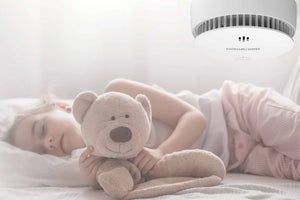 Why is my interlinked smoke alarm beeping at night?